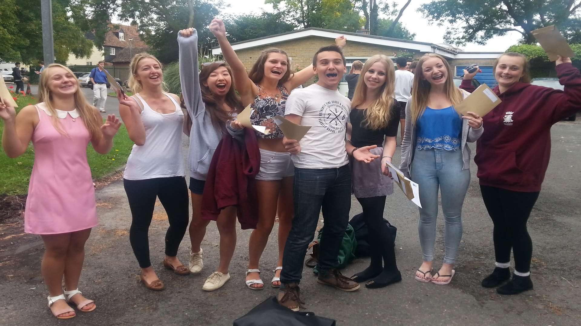 Group of pupils celebrating their results at Queen Elizabeth's Grammar in Faversham