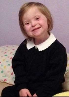 Poppy Rayment has an extra chromosome, which is thought to be a contributing factor to her Downs syndrome.