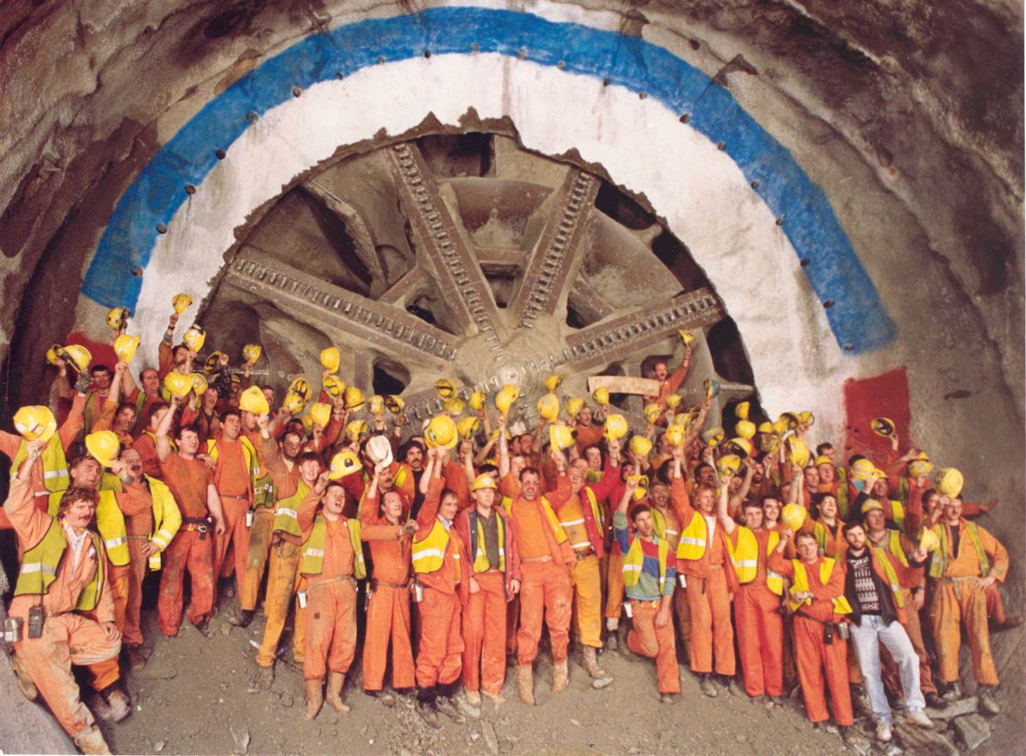 Channel Tunnel workers near Folkestone with the boring machine used to cut through the earth. Mr Horne had helped in the construction