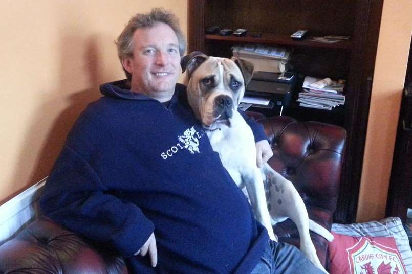 Gareth Davies, who has had equipment confiscated by Medway Council for the second time, at home with his dog Alfie
