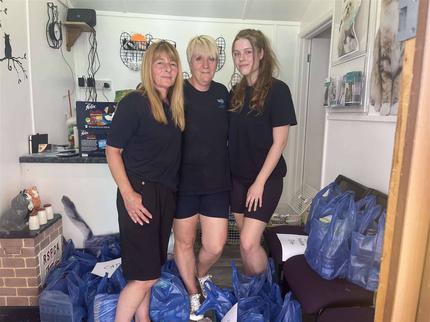 Lisa Dennis, Debbie Lepine and Rachel Sinden are happy that the pet food bank is finally open, especially during such a financially difficult time for so many people