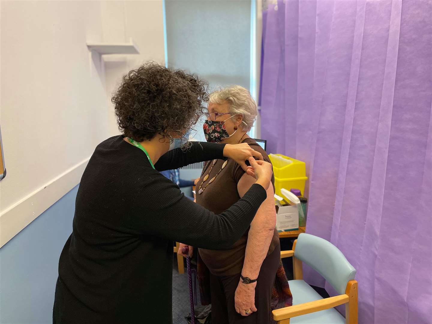 Dr Hilary Audsley, GP at The Chestnuts Surgery in Sittingbourne, giving patient Rowena Mount her first dose of the coronavirus vaccine at the town's Age UK centre