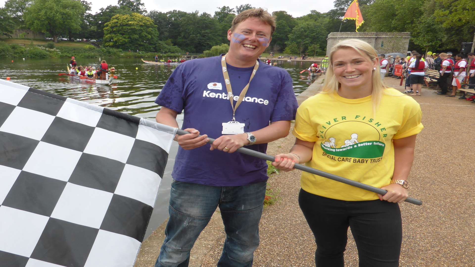 Robert Gurr of Kent Reliance, Chatham, and rugby champ Rachael Burford, Medway waved the chequered flag at the record breaking KM Dragon Boat Race, Mote Park, Maidstone where 43 teams raised £100k for 25 charities.