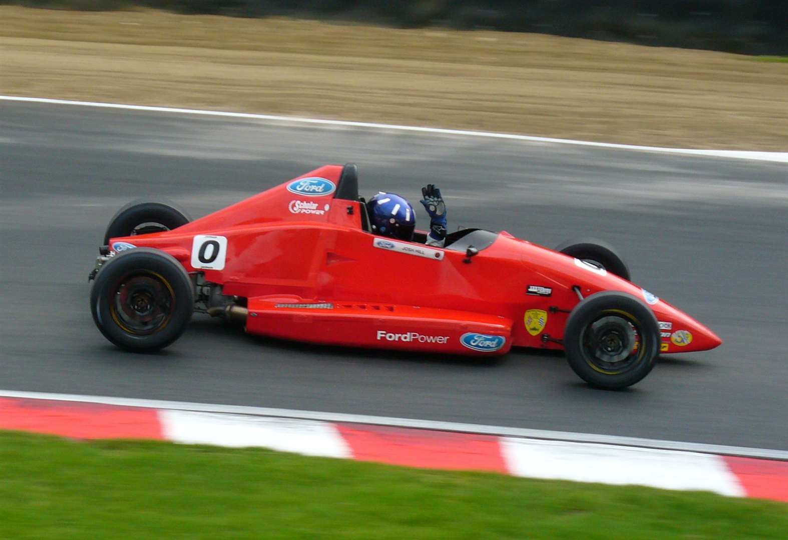 David Brise says the family's helmet design has become a "Hill-like crest". Here, at Brands Hatch in 2010, Damon's son Josh is wearing the famous London Rowing Club colours where his grandad used to be a member. Picture: Vic Wright