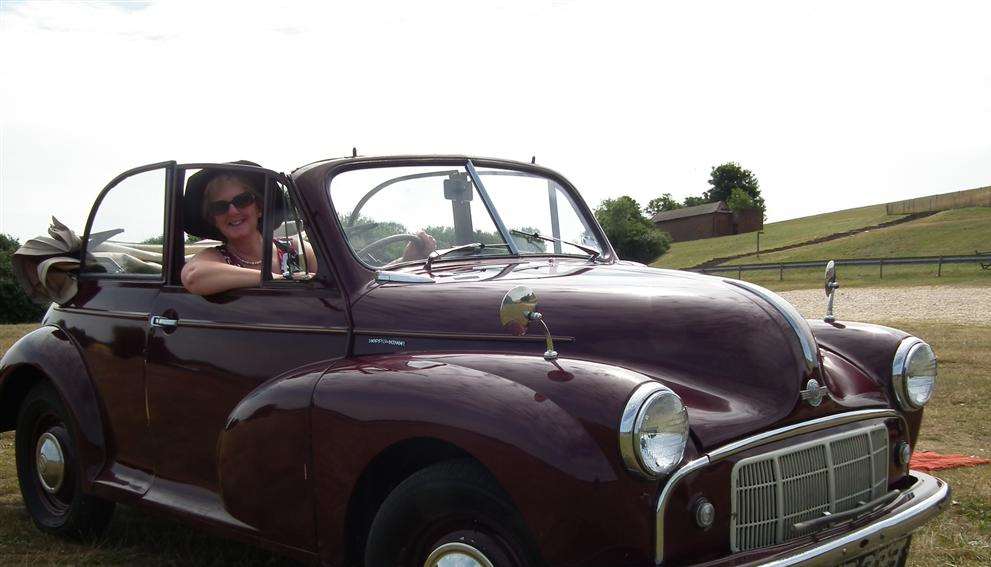 Lesley Bellew in a Morris Minor similar to one driven by the fictional character Miss Marple