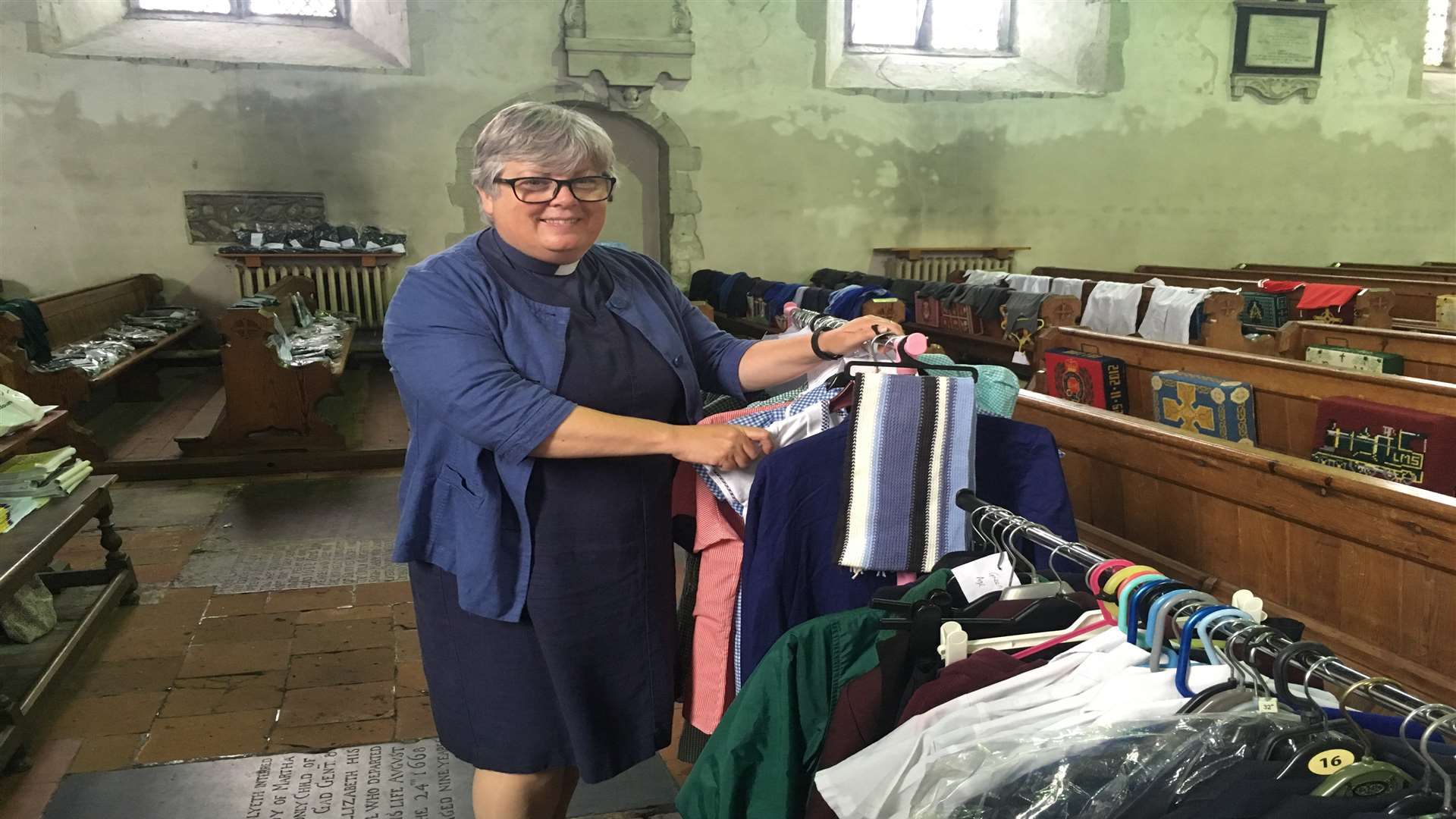 Reverend Lesley Jones looks through donations