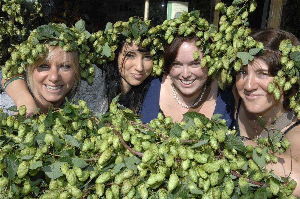 Louise Harding, Katie Moore, Lisa Duce and Charlotte May surround themselves with hops during the Faversham Hop Festival