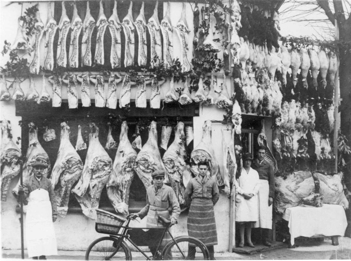 A rare shot of the butchers shop in Upper Denmark Road, Ashford, run by Frank and Win Brown. Hygiene laws were more lax with the meat always hanging outside the shop, including this selection prepared for the Christmas Market show of 1931. Picture: Images of Ashford by Mike Bennett
