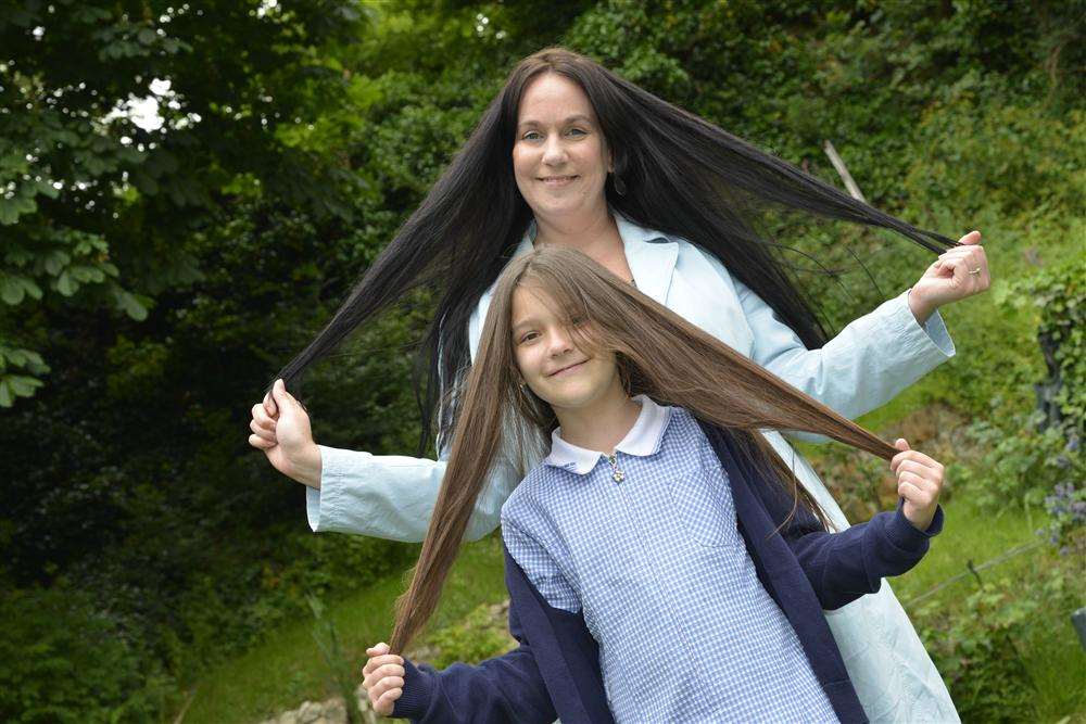 Janine Lawrence and her daughter Helen Jury are having their long hair chopped off in aid of a charity which creates wigs for children who have lost their hair. Picture by: Martin Apps FM2641732