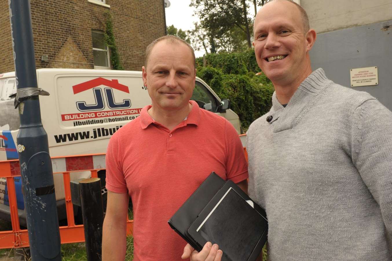 Builder Jarek Luszcz, left, who helped architect David Meaney recover his stolen iPad