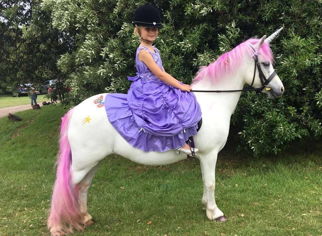 Annabel Sykes, six, with her 14-year old pony Rosie