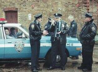 "NYPD cops" at the scene