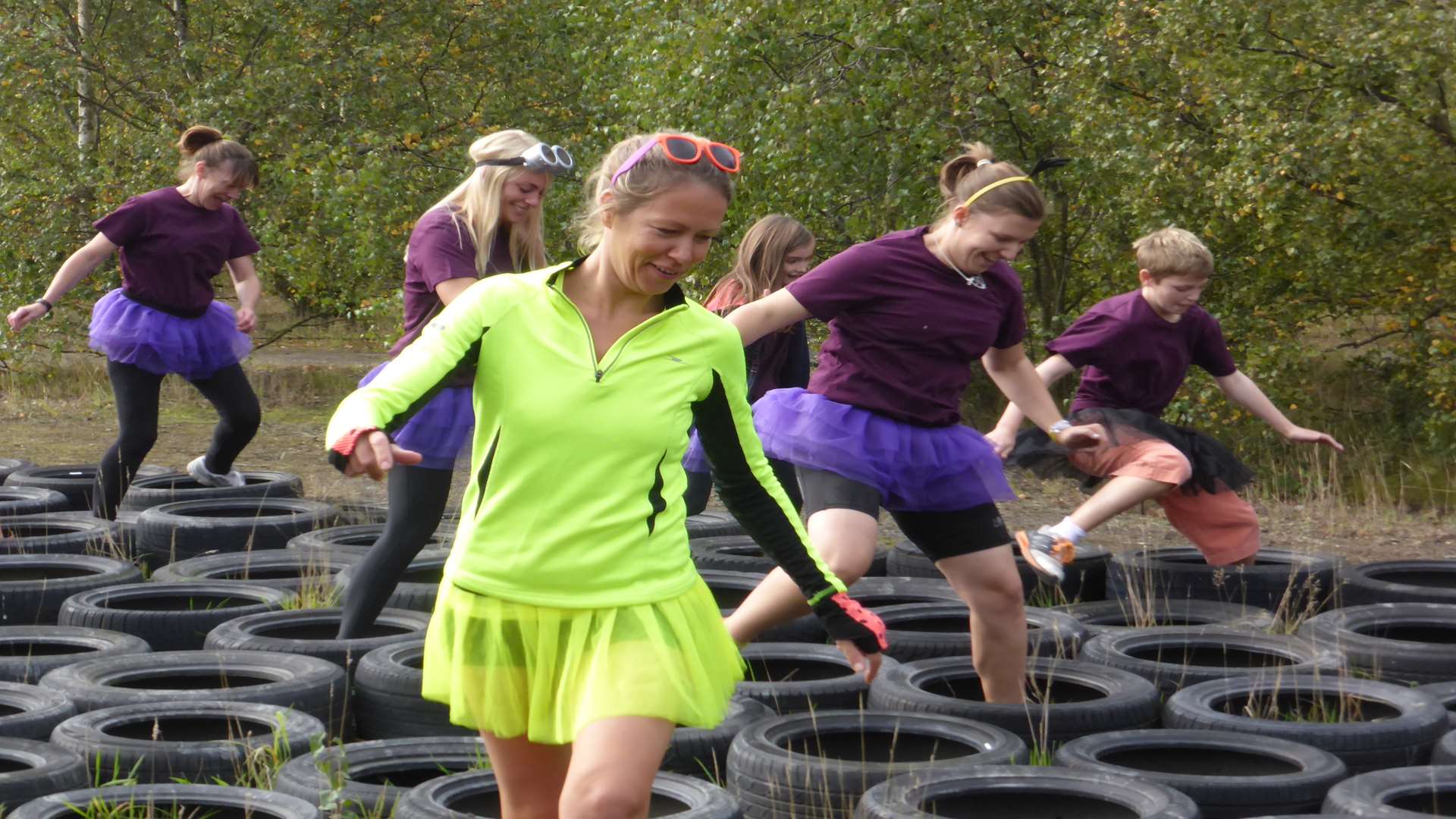 Participants conquer the tyre walk at the KM Assault Course Challenge. Booking is now open for the 2016 event staged at Betteshanger Park, Nr Deal on Saturday, October 1.