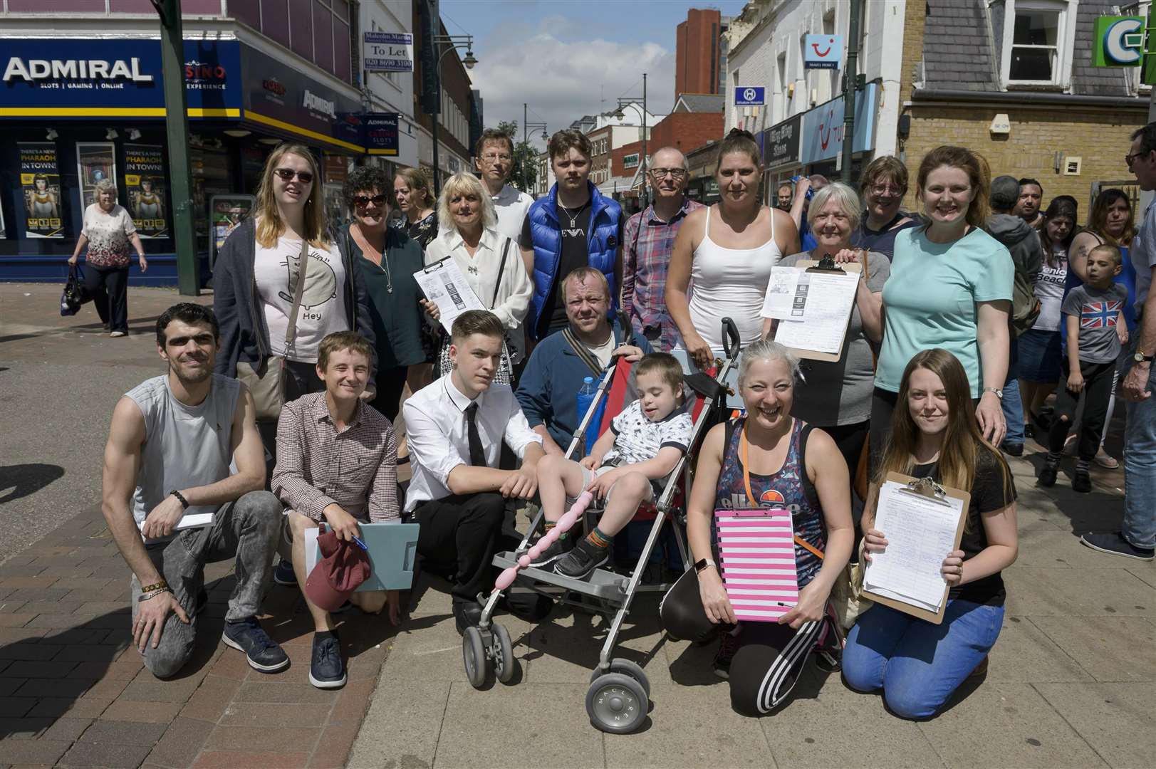 Petitioners gather signatures in High Street, Chatham, for Abbey Court School juniors who may not get a place in the senior department unless the school can build at Cliffe Woods. Picture: Andy Payton