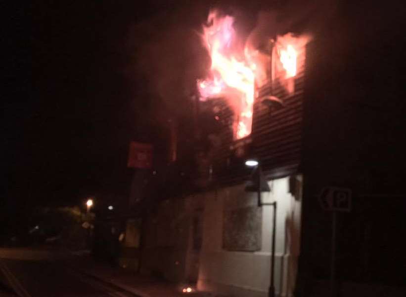 Flames are pouring out of the windows. Picture: Matt Kemsley