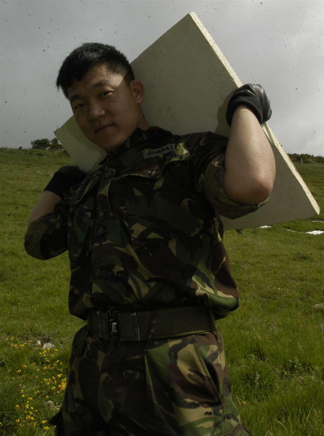 Nagen Rai about to place one of the chalk slabs on the hillside in June 2003