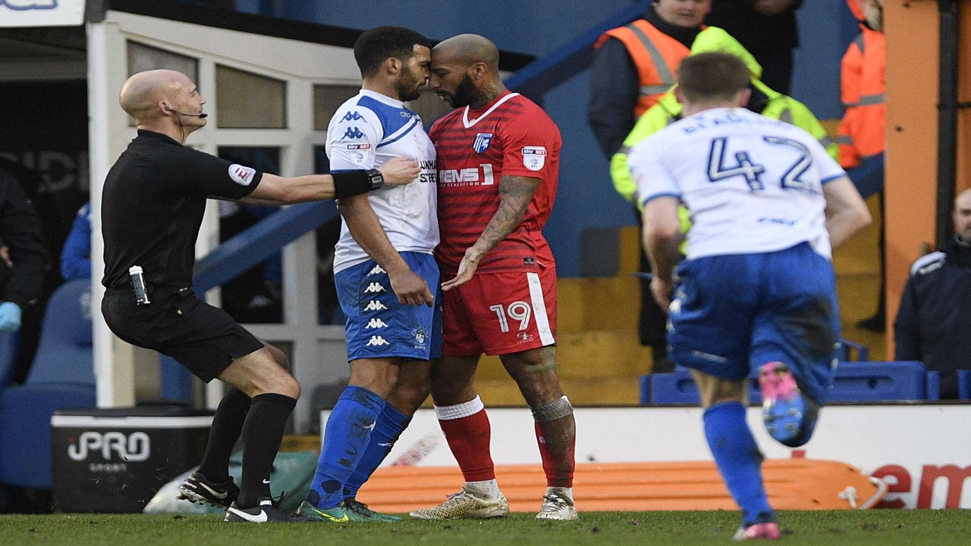 Referee Darren Drysdale separates Josh Parker and Jacob Mellis when the sides last met at Gigg Lane Picture: Ady Kerry