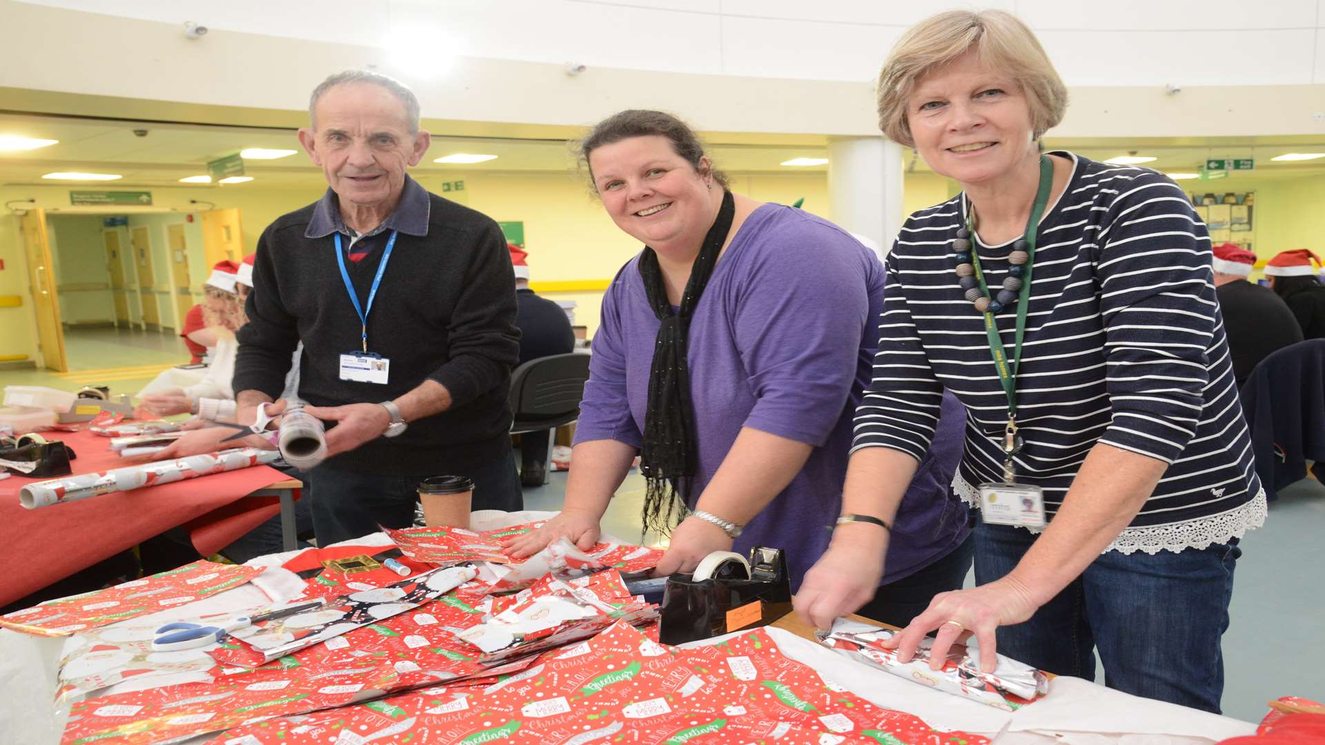 Volunteers Melvyn Goodman, Sarah Shsave and Ann Howton from MHS Homes Volunteers wrapping gifts. Picture: Gary Browne