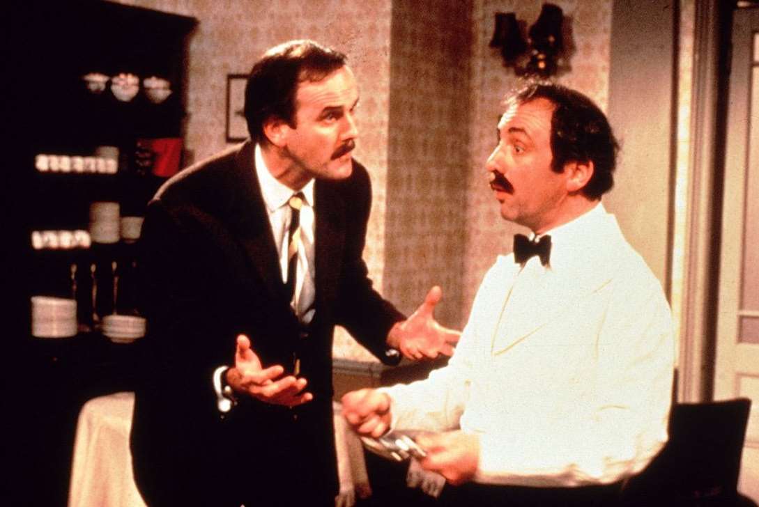 Faulty Towers with John Cleese as Basil Fawlty and Andrew Sachs as Manuel