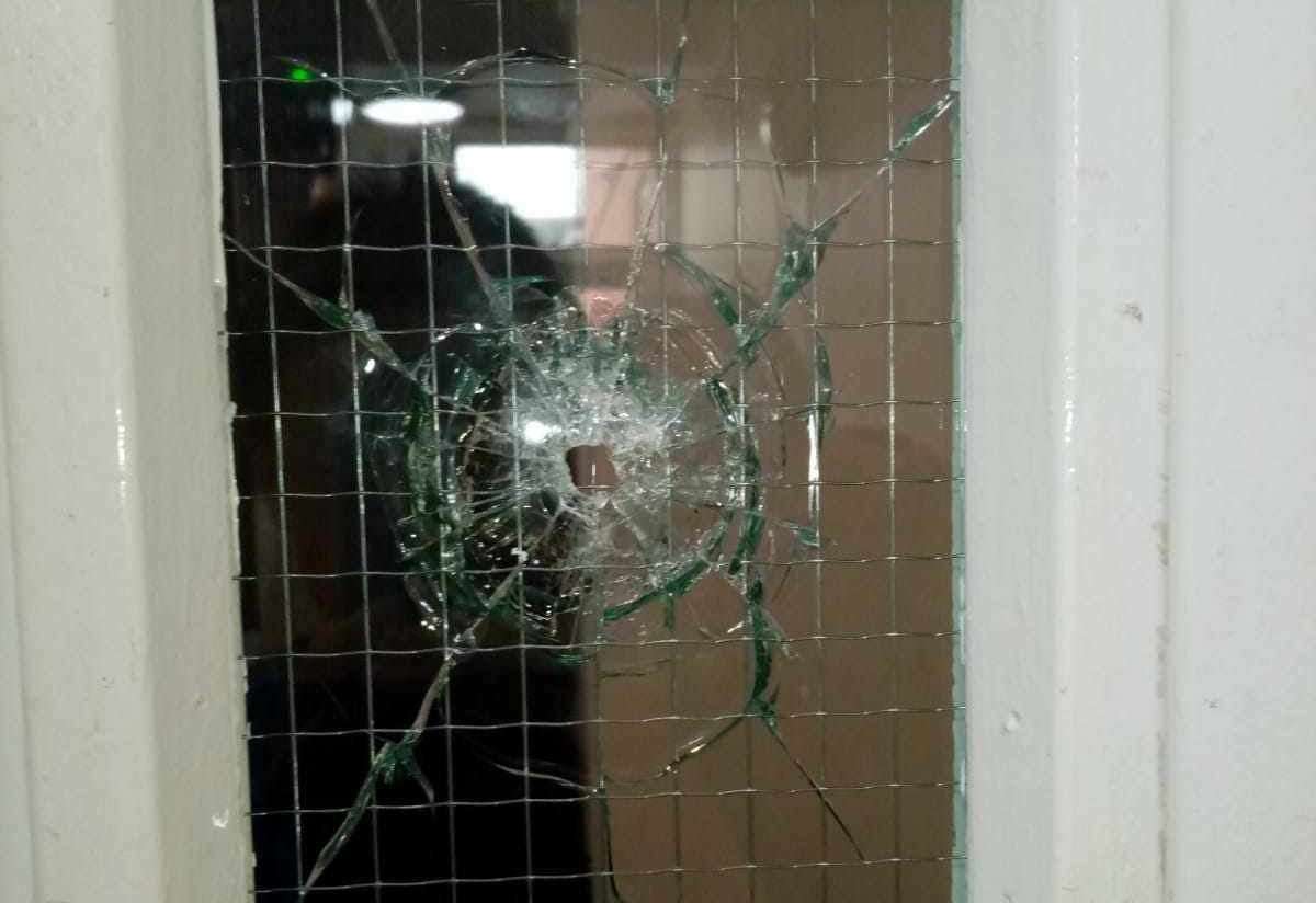 A smashed window in the block of flats at Stanhope Court