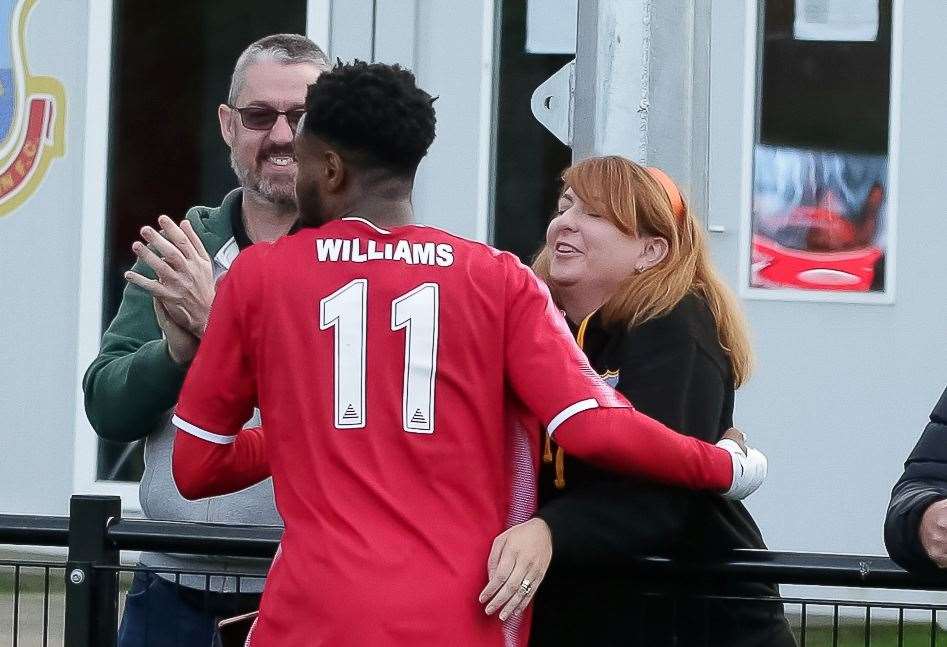Josh Williams celebrates his winning goal with club secretary Fran Milne as Whitstable earn a 2-1 weekend win against VCD Athletic. Picture: Les Biggs