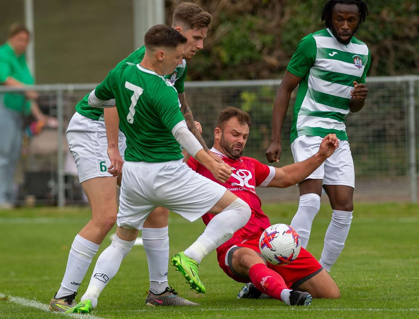 Corinthian midfielder Sam Bewick gets one over his old club – title favourites Town – early in the campaign as he challenges then-Faversham forward Gary Lockyer. Picture: Ian Scammell