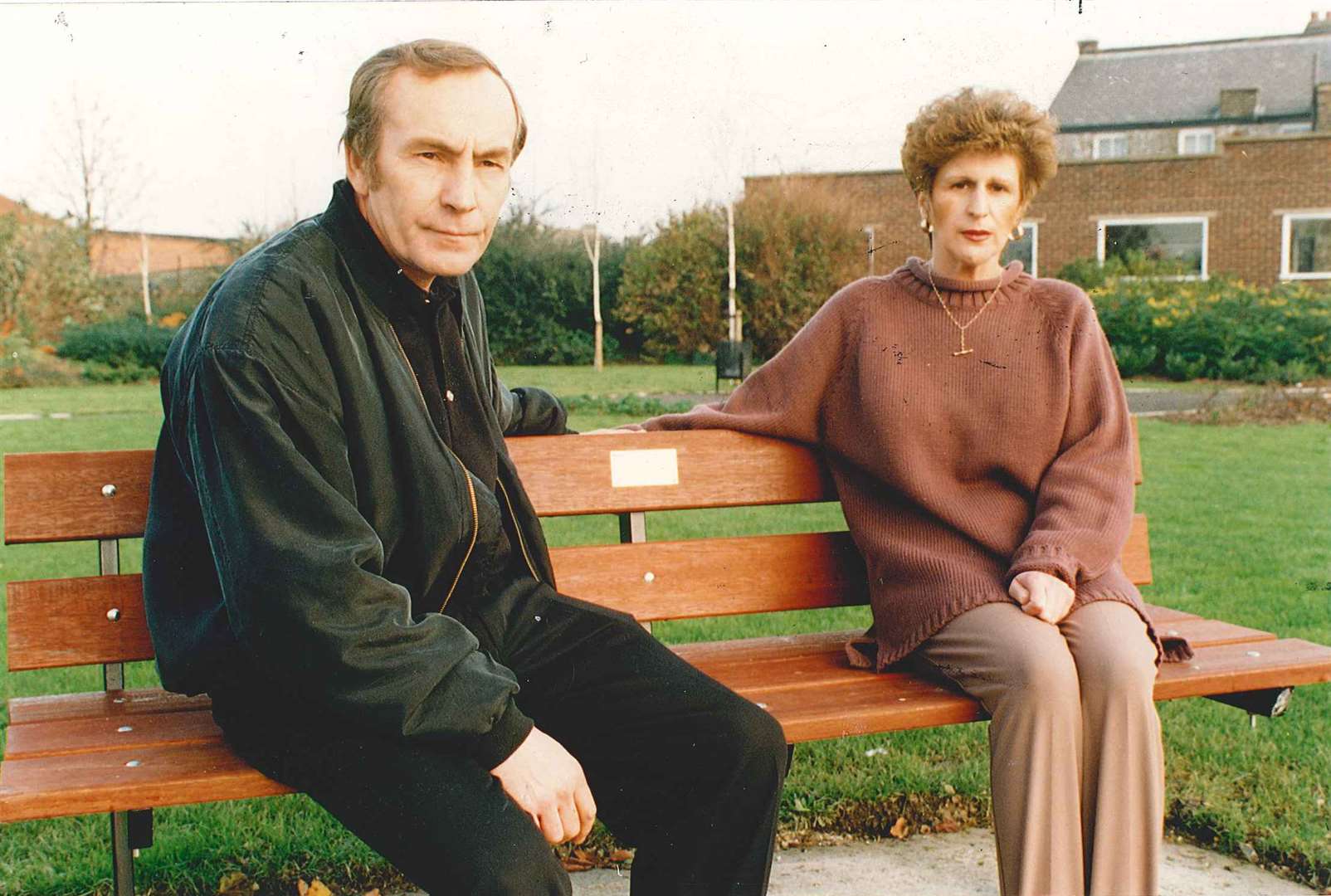 Cliff and Linda Tiltman at a bench in memory of their daughter