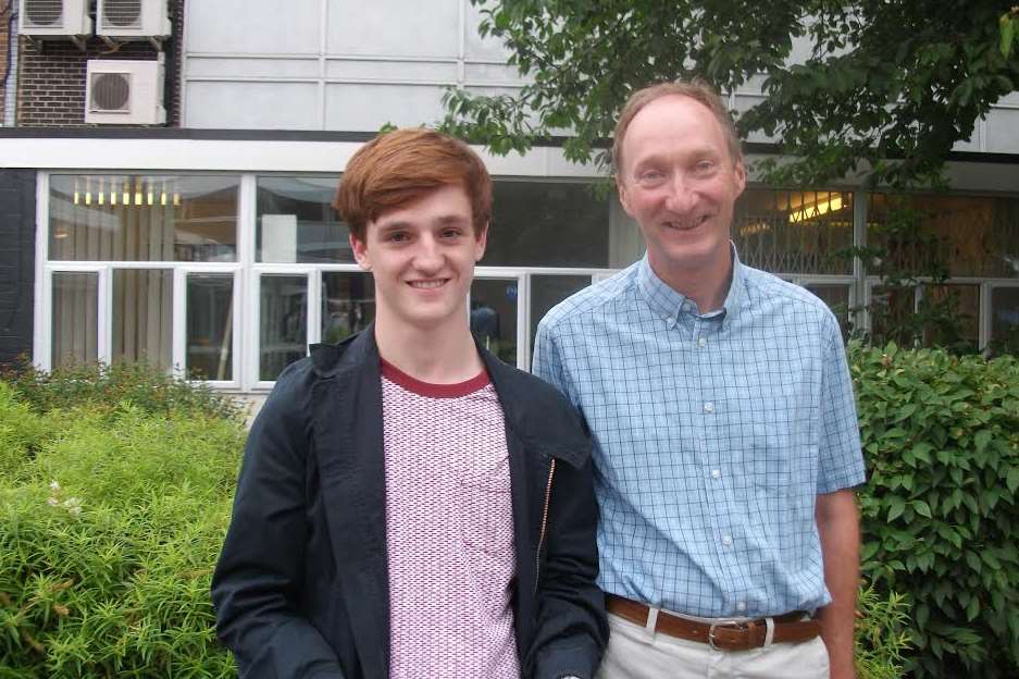 James Cushway achieved 3 A* grades and an A grade, pictured with deputy head of WG6, Charles Sexton.