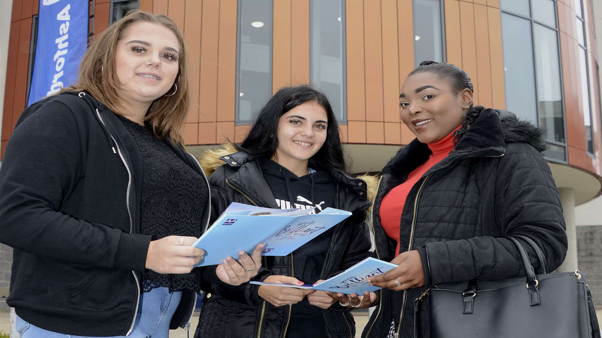 Chloe Day, 17, and Talia Scaysbrook, 16, signing up for business studies and Shinnai Gayle for a beauty course
