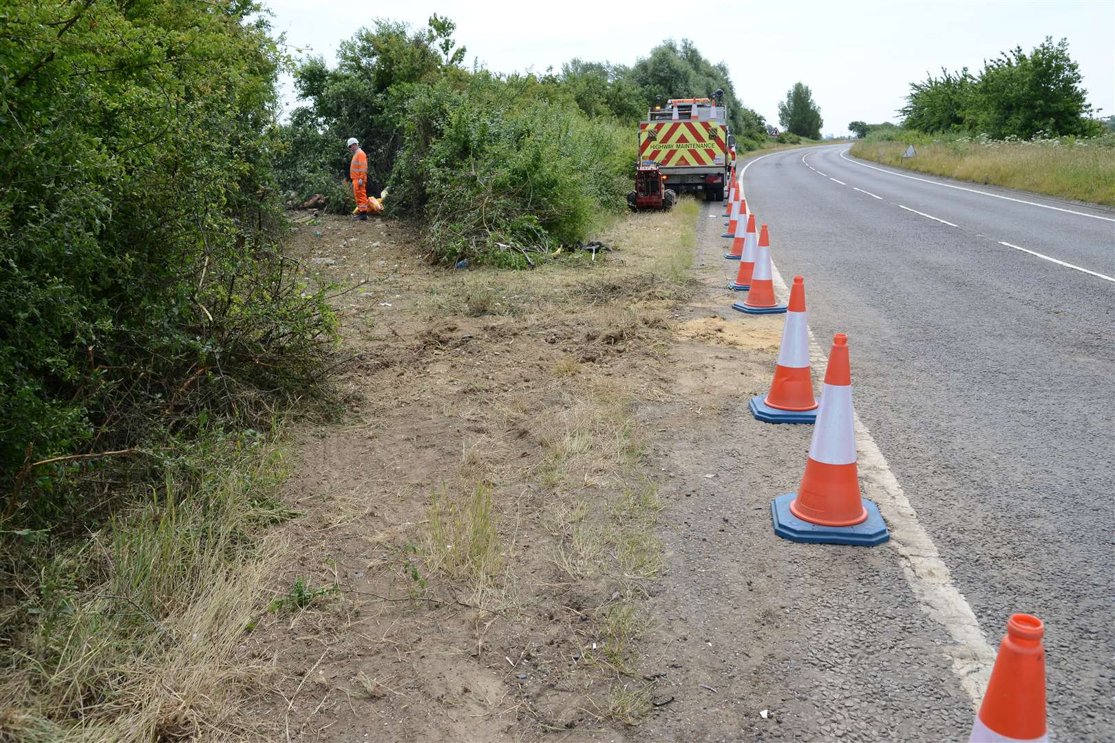Traffic cones left by highway workers dealing with the A2070 crash.