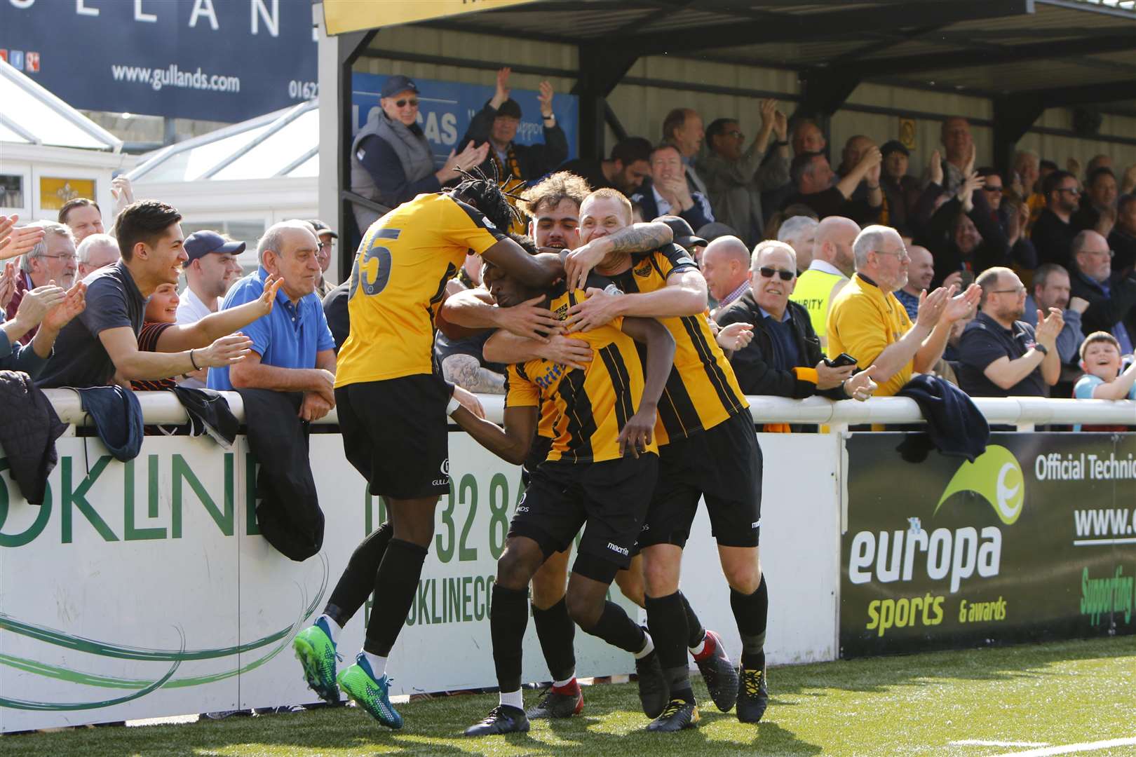 Andre Coker, left, joins the celebrations after Maidstone's winner against AFC Fylde Picture: Andy Jones