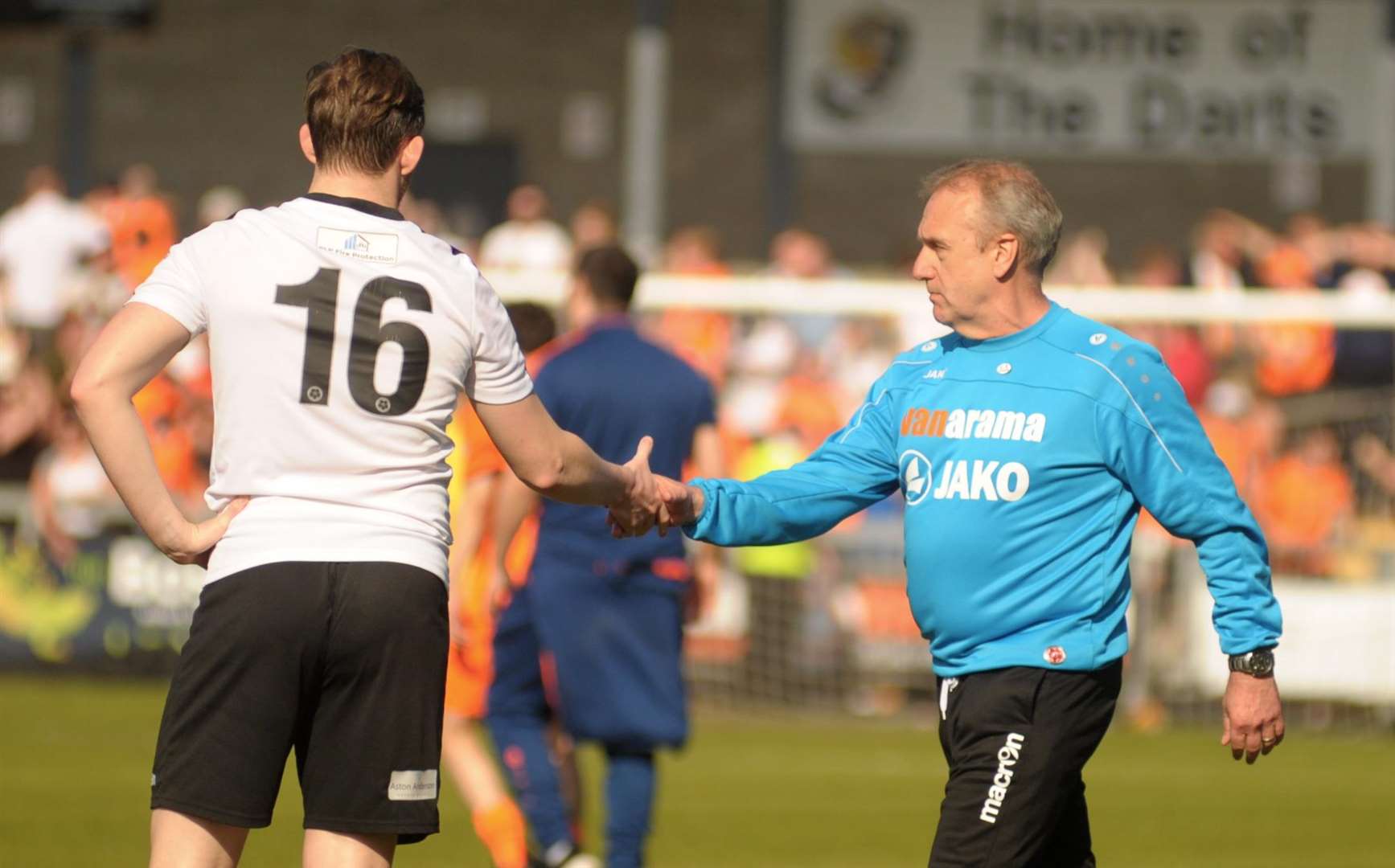 Tony Burman shakes hands with Tom Murphy after his final game in charge of Dartford - the National League South play-off semi-final defeat to Braintree Picture: Steve Crispe