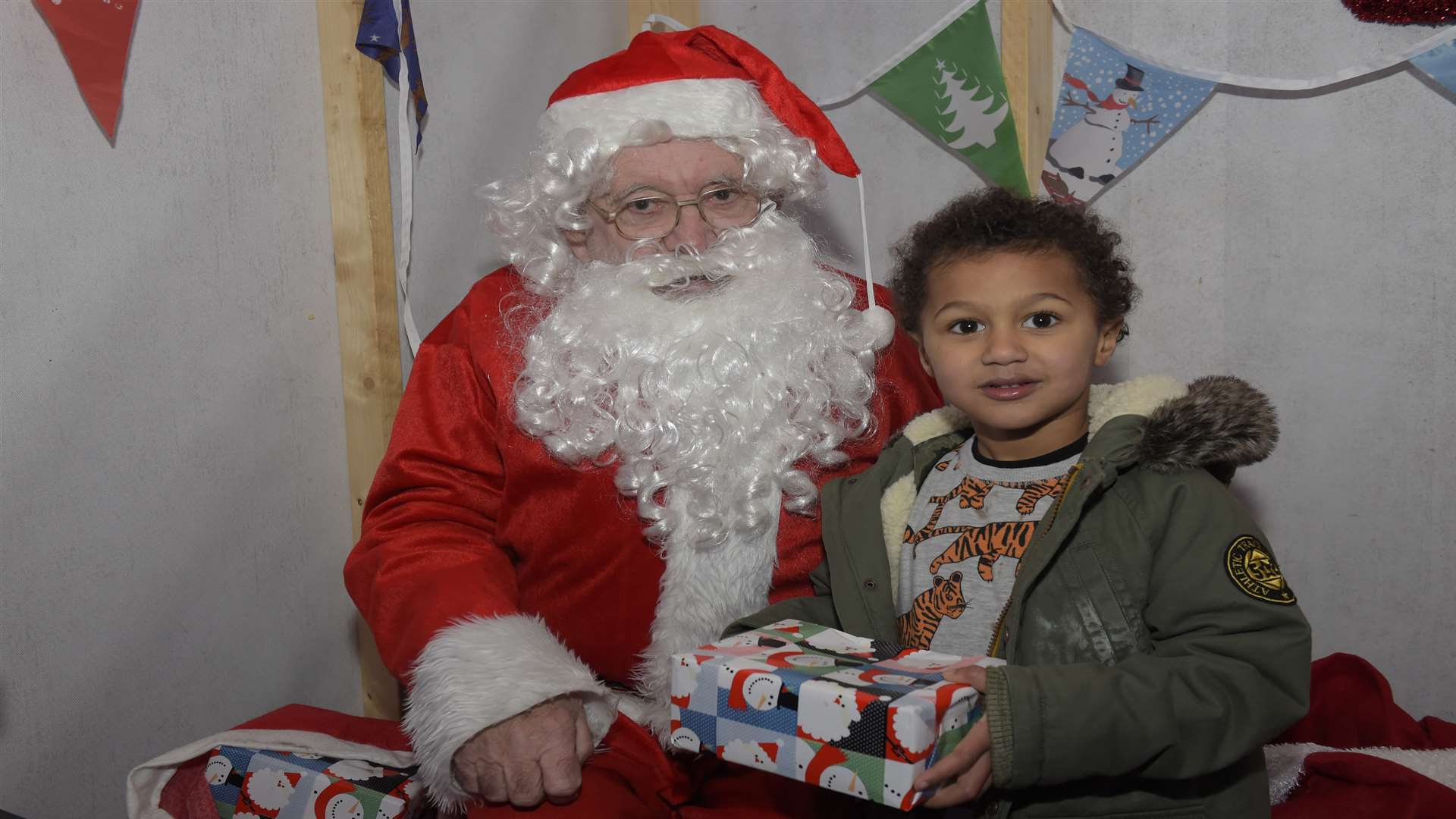 Henry Lopez aged five meets Santa