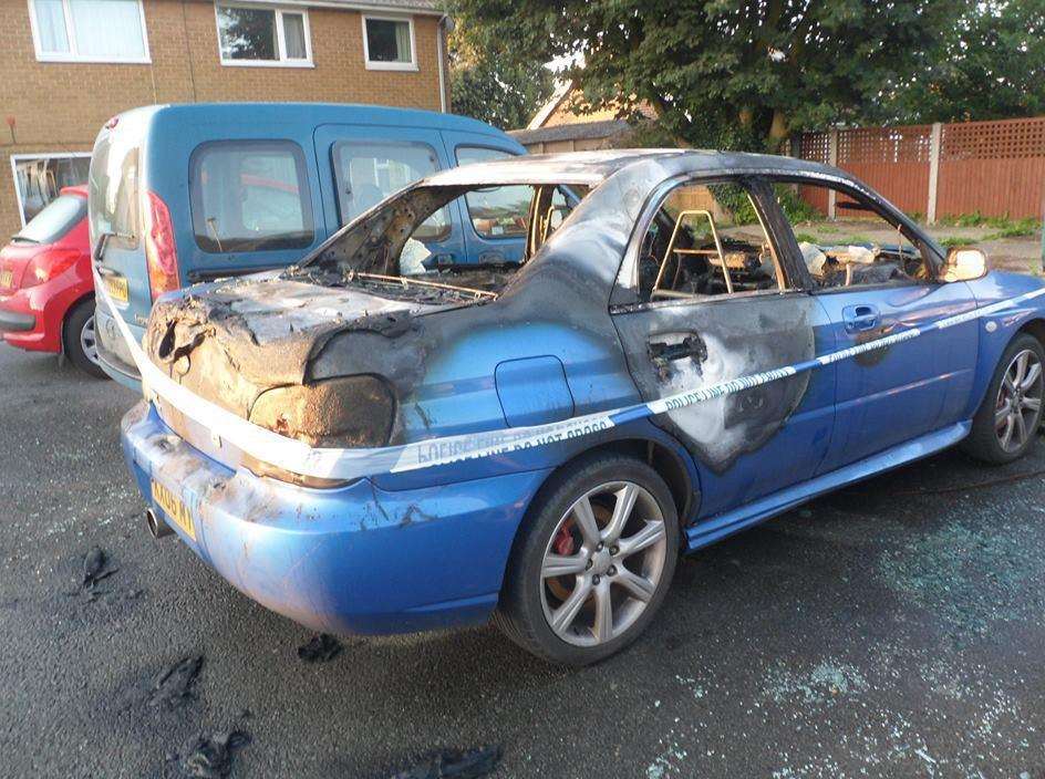 The blue car after an arson attack on Wednesday night
