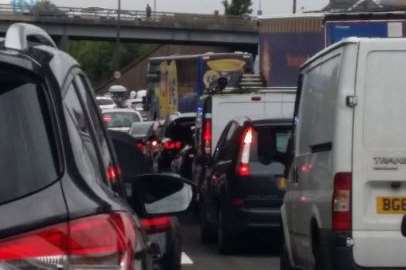 Cars came to a standstill on the M25 while police helped a man on a bridge. Picture by Terri-Ann Pearce
