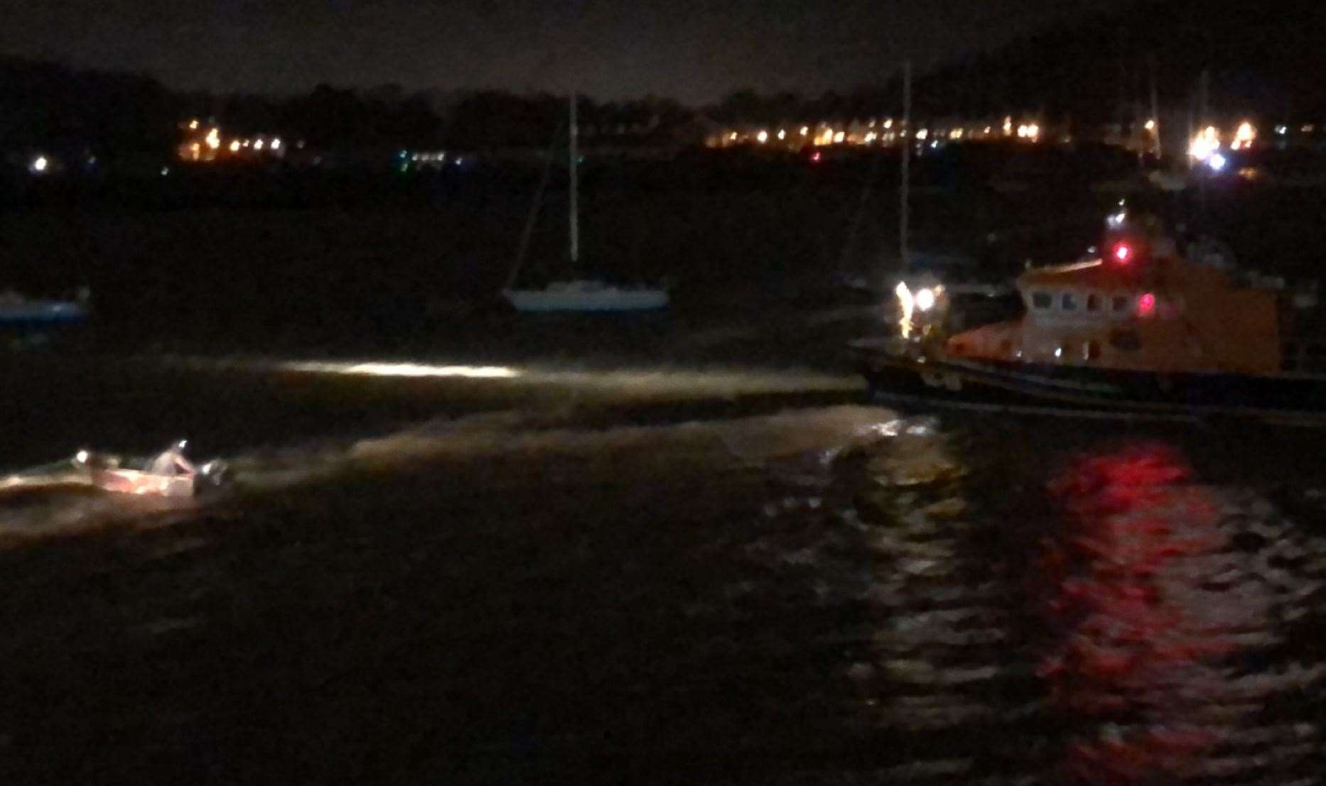 Lifeboat crews attempt to rescue a man from the river Medway during Storm Dennis. Picture: Stacey Gallagher