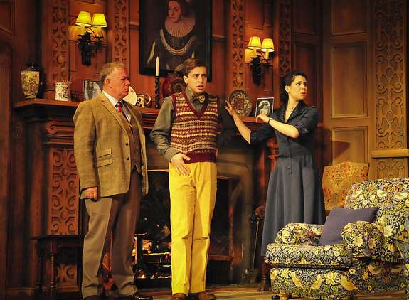 Characters Major Metcalf, Christopher Wren and Mollie Ralston stand in the Monkswell Manor guest house in Agatha Christie's The Mousetrap