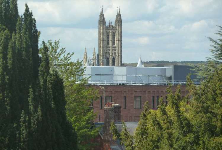 The view of St Martin's Church and Canterbury Cathedral which residents say has been ruined by the air conditioning and ventilation units on top of the new Canterbury Christ Church University building. Picture: Hubert Pragnell