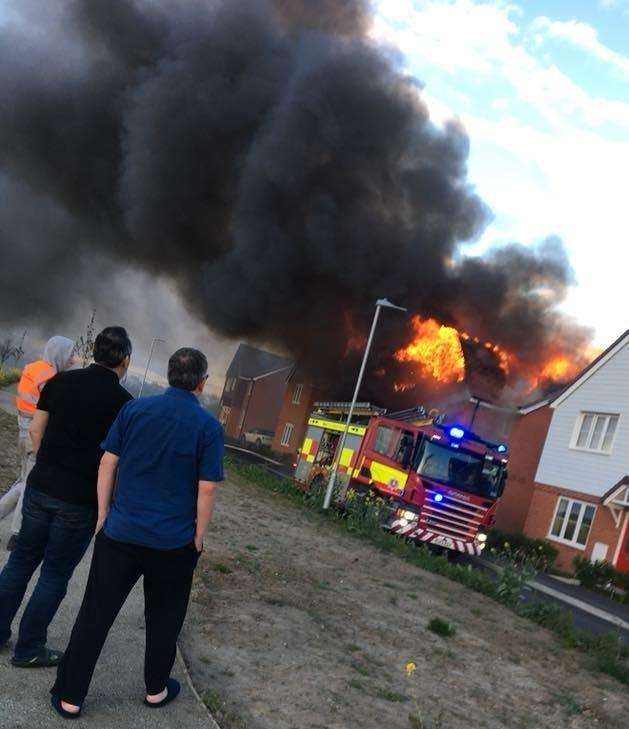 The fire has ripped through at least two homes