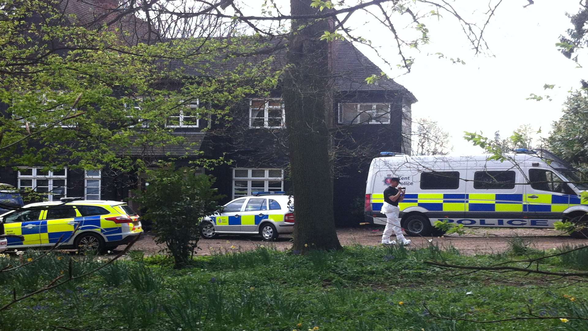 Police take pictures in the grounds of Peaches Geldof's home. Picture: Kiran Kaur