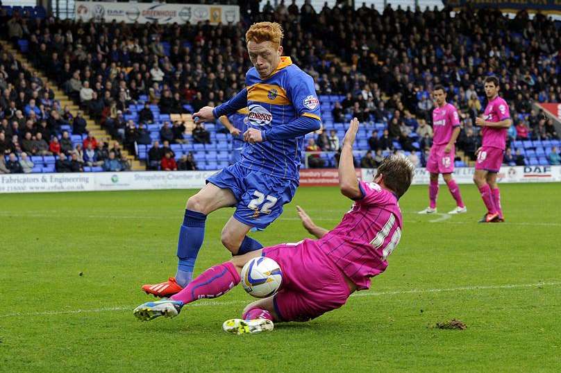 Charlie Lee goes in for a challenge on Ryan Woods Picture: Barry Goodwin