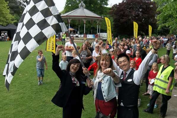 The record breaking KM Big Bus column heads off from the Dane John Gardens. Waving the starter flag is Sam Williams and Michael Chan of Specsavers and Elizabeth Carr of Mini Babybel (centre).