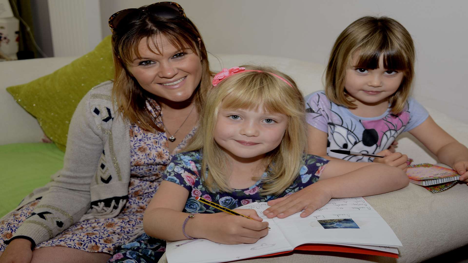 Felicity Carter says that the new Ipads in McDonald's are not a good idea. Seen here with mum Melissa and sister Florence
