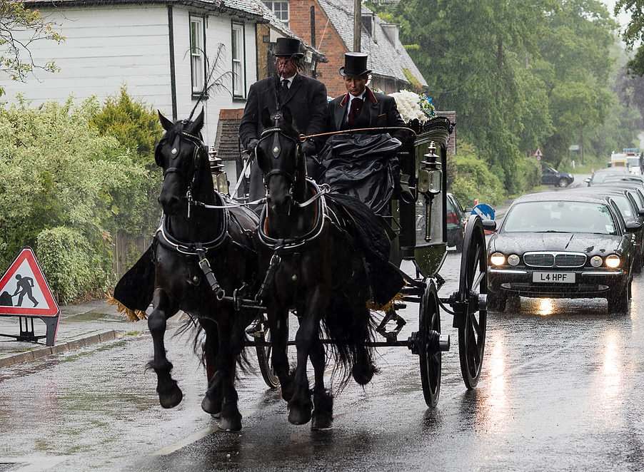 The coffin Bill Smith is carried to The Parish Church of St George, Benenden