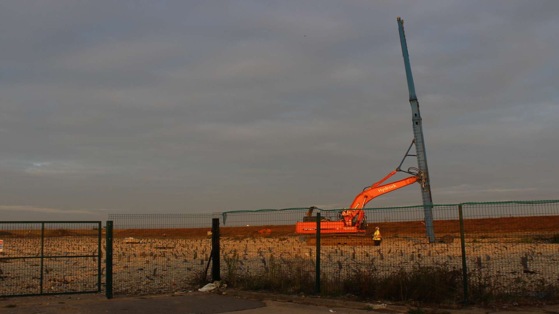 A digger helps with piling work on the Rushenden site