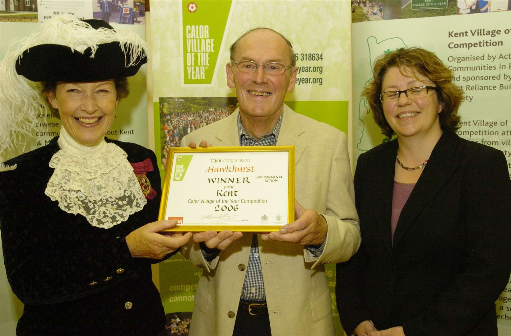 John Hunt accepting the award for Hawkhurst as the Environmental Action winner in the 2006 Village of the Year contest with the High Sheriff Amanda Cottrell and the CEO of Kent CPRE, Hilary Newport