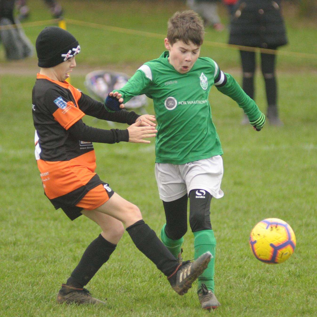 Pegasus 81 under-10s and Horsted Youth under-10s battle for possession. Picture: Steve Crispe FM6473902