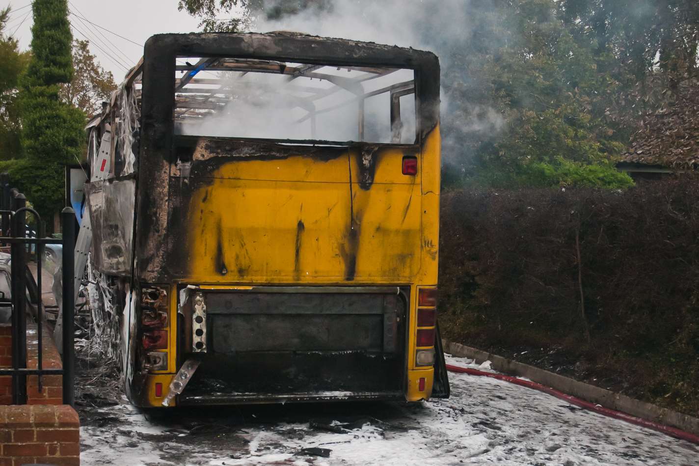 The coach was covered in foam as firefighters battled the blaze. Picture: Andy Flood