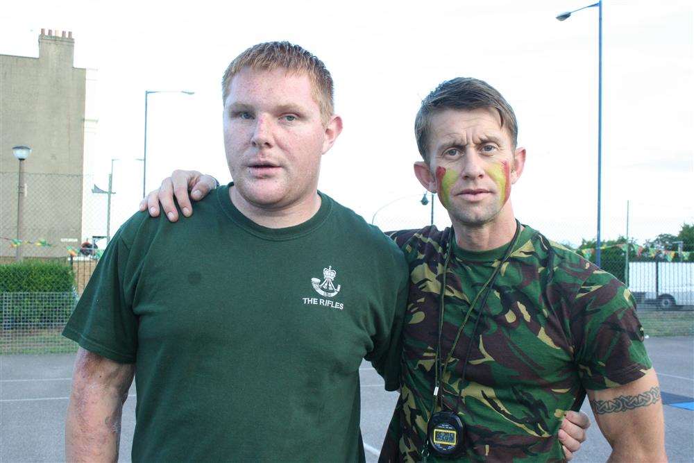 Paul Jacobs, who was awarded the George Cross for bravery, with personal trainer Jason Turner
