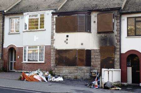 Floral tributes outside the blaze house in Chatham Hill